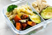Meal prep containers with chicken, quinoa, and veggies