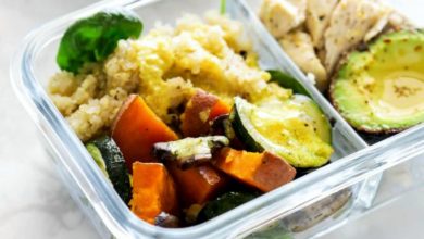 Meal prep containers with chicken, quinoa, and veggies