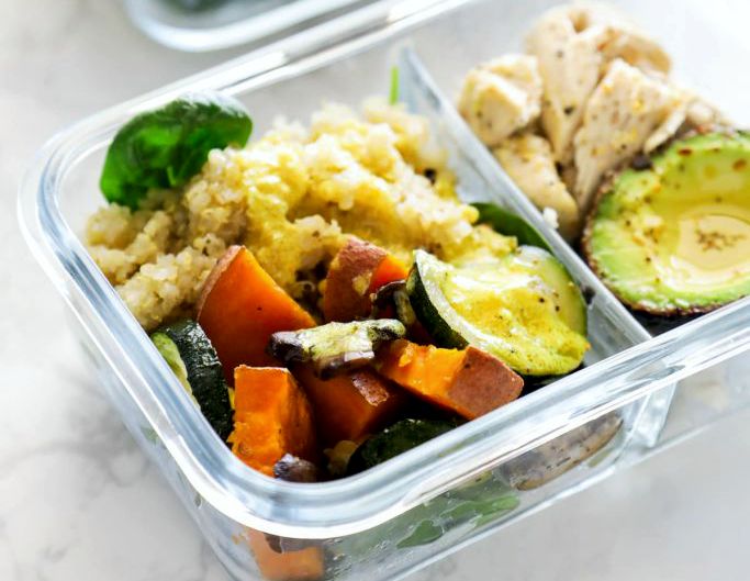 Meal prep containers with chicken, quinoa, and veggies