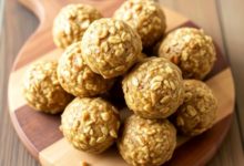 Peanut butter oat energy balls on a wooden board