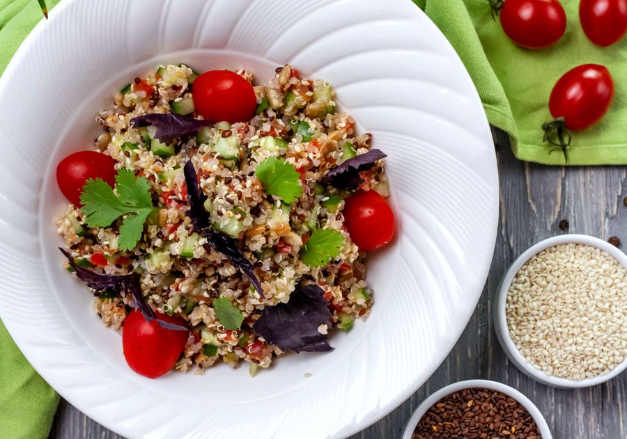 Colorful vegan Buddha bowl with vegetables and quinoa